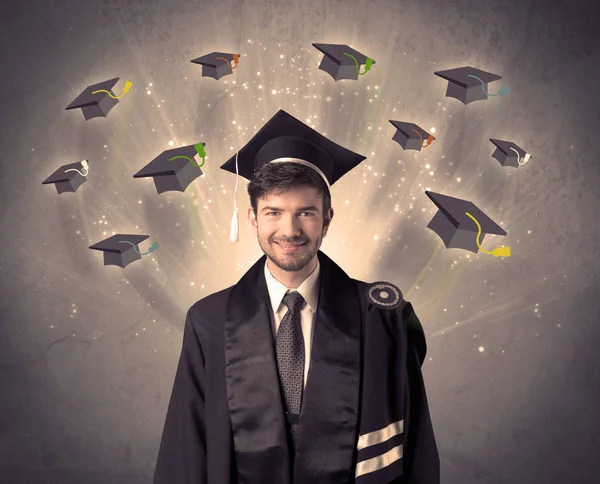 Graduado universitario con muchos sombreros voladores — Foto de Stock