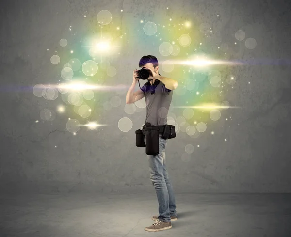 Photographer with flashing lights — Stock Photo, Image