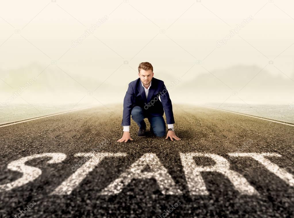 Businessman at start line