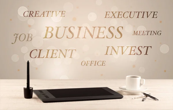 Business office desk with writing on wall — Stock Photo, Image