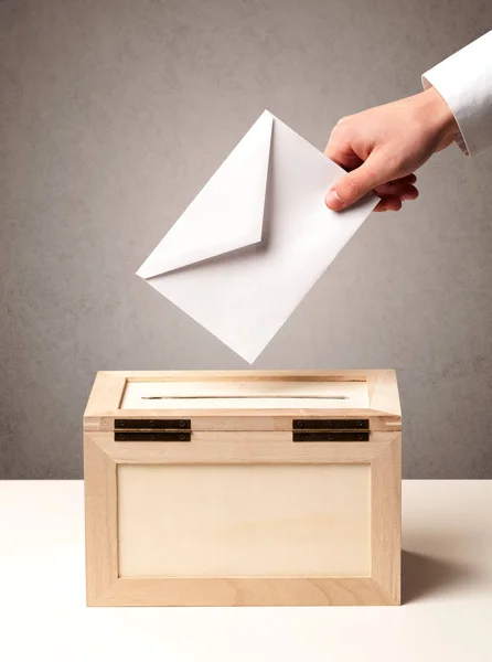 Ballot box with person casting vote — Stock Photo, Image