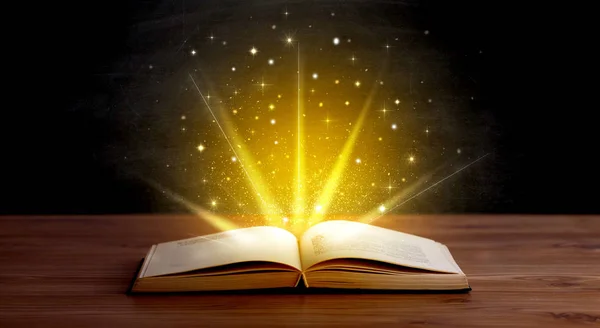 Yellow lights over book — Stock Photo, Image