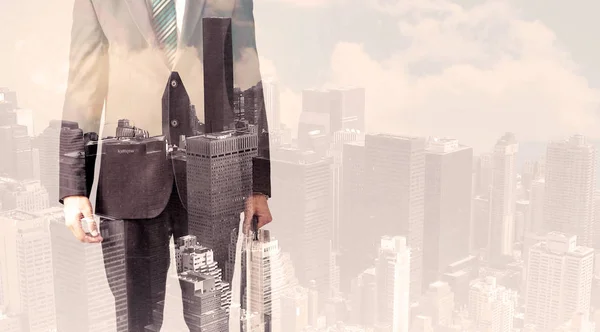 Handsome business man with overlay cityscape — Stock Photo, Image