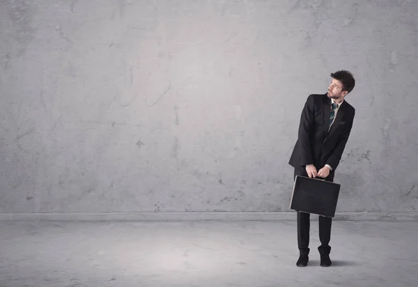 stock image Young businessman standing confused