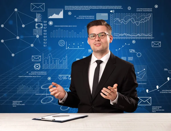 Businessman sitting at a desk — Stock Photo, Image