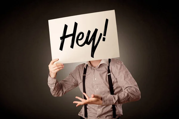 Businessman holding paper with greeting — Stock Photo, Image