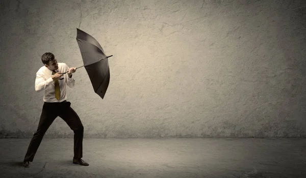 Handsome business man holding umbrella with copy space backgroun — Stock Photo, Image