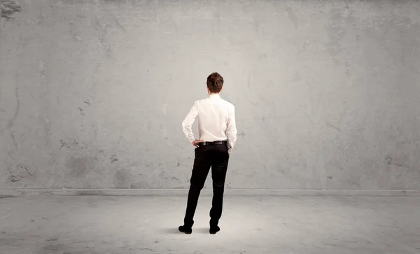 Businessman lost in empty urban space — Stock Photo, Image