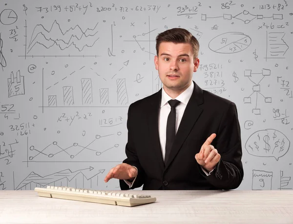 Businessman sitting at a desk — Stock Photo, Image