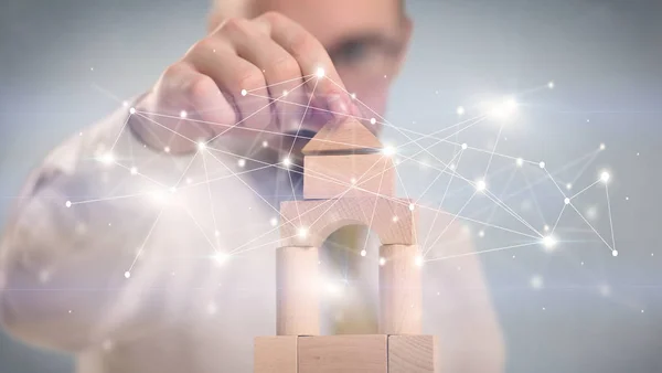 Businessman building a tower — Stock Photo, Image