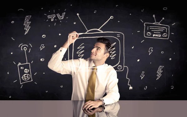 Happy businessman drawing tv and radio — Stock Photo, Image