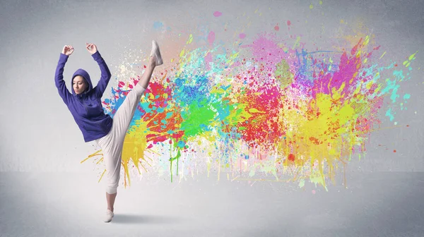 Young colorful street dancer with paint splash — Stock Photo, Image