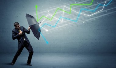 Şemsiye ve borsa okları kavramına sahip iş adamı