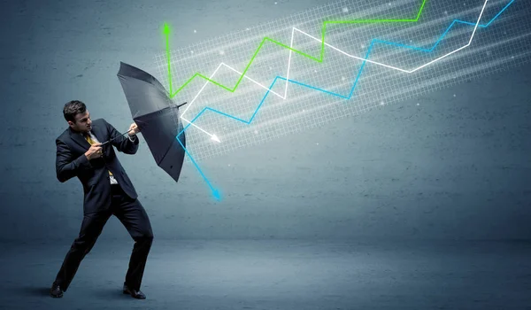 Business person with umbrella and stock market arrows concept — Stock Photo, Image