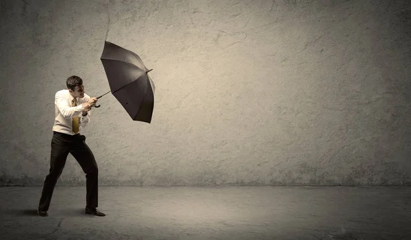 Hombre de negocios guapo sosteniendo paraguas con espacio de copia backgroun —  Fotos de Stock