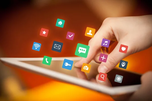 Fingers touching tablet with apps — Stock Photo, Image