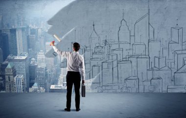 Zarif satıcı şehri duvarda yeniden boyuyor.