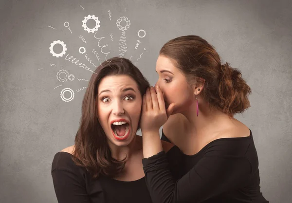 Girl telling secret things to her girlfriend — Stock Photo, Image