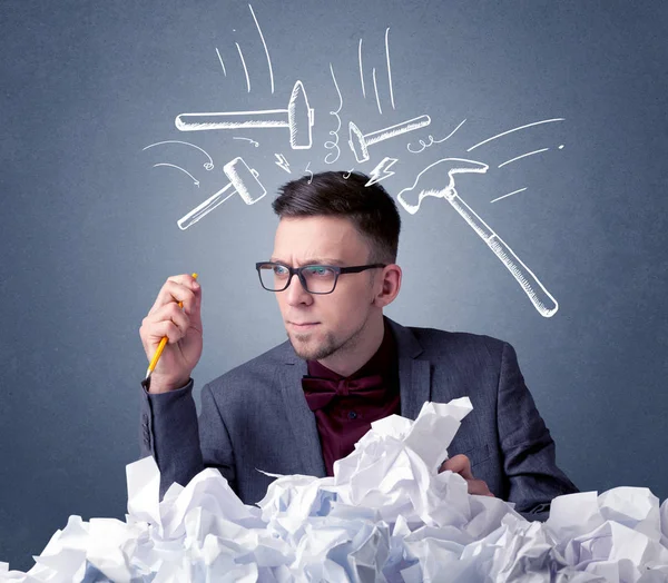 Businessman above crumpled paper — Stock Photo, Image