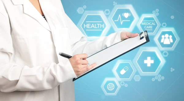 Female doctor holding notepad — Stock Photo, Image