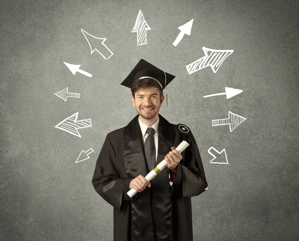 Jeune étudiant diplômé avec des flèches dessinées à la main — Photo