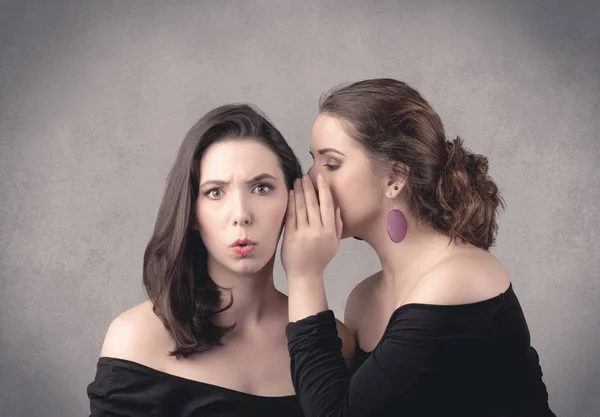 Girl telling secret things to her girlfriend — Stock Photo, Image