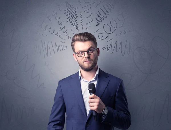 Businessman holding microphone — Stock Photo, Image