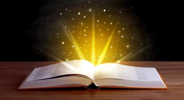 Yellow lights over book — Stock Photo, Image