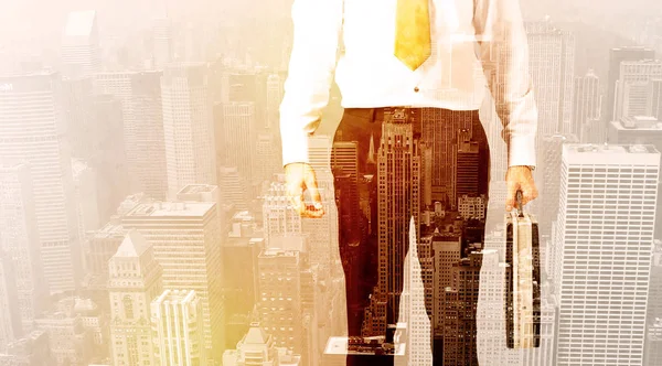 Business man looking at overlay city background — Stock Photo, Image