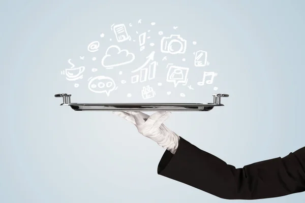 Waiter holding tray with media icons — Stock Photo, Image
