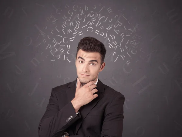 Businessman with alphabet — Stock Photo, Image