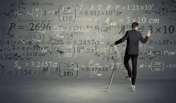 Man calculating from ladder — Stock Photo, Image