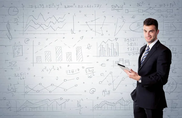 Salesman standing with drawn graph charts — Stock Photo, Image