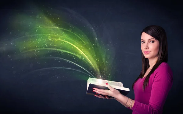 Young lady holding book with wave — Stock Photo, Image