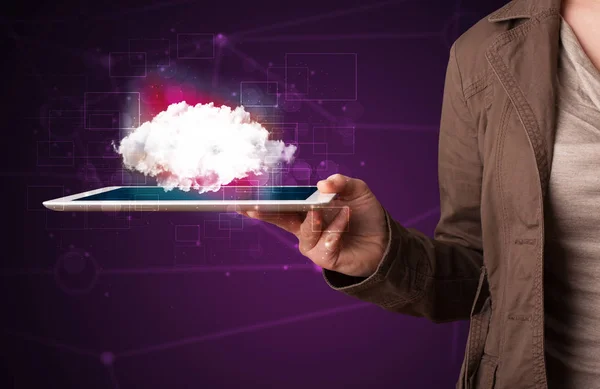 Woman holding tablet with cloud graphic — Stock Photo, Image