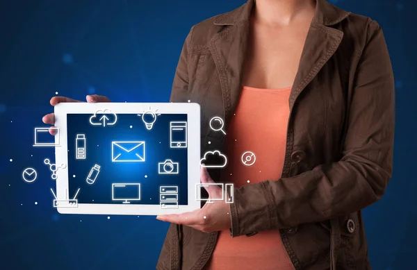 Woman holding tablet with media graphics — Stock Photo, Image