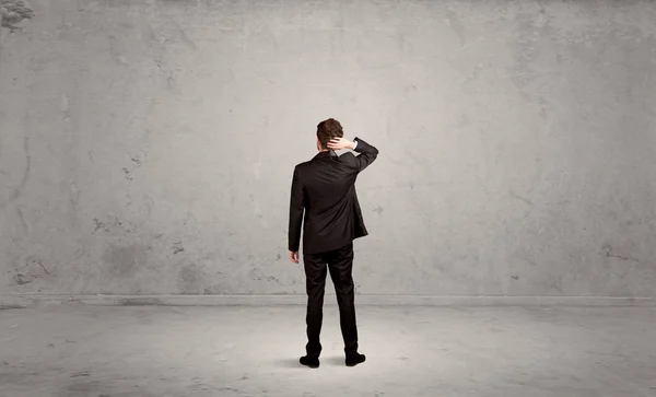 Businessman lost in empty urban space — Stock Photo, Image