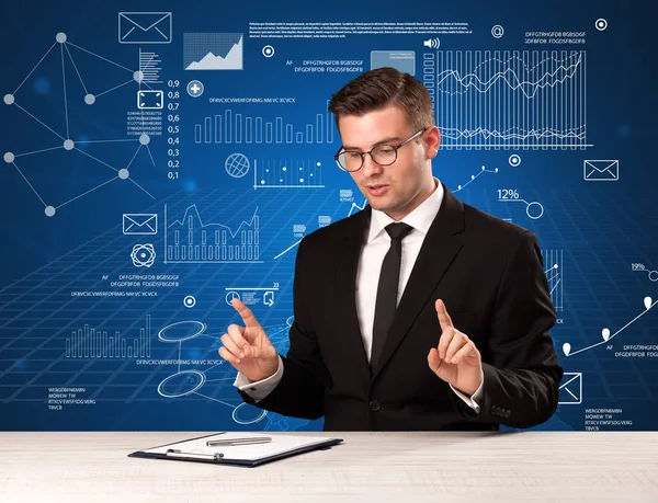 Businessman sitting at a desk — Stock Photo, Image