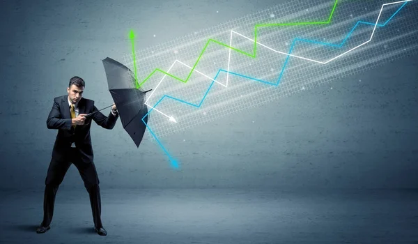 Business person with umbrella and stock market arrows concept