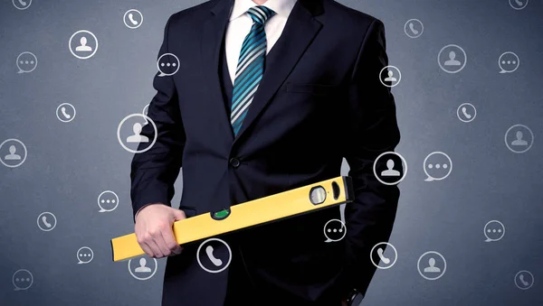 Handsome man standing with tool on his hand — Stock Photo, Image