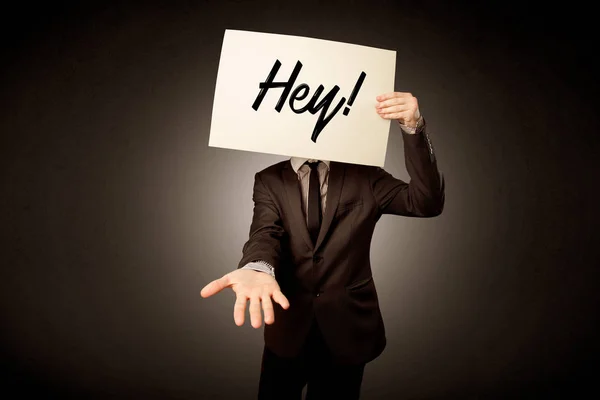 Businessman holding paper with greeting — Stock Photo, Image