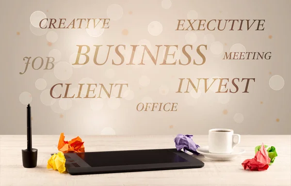 Business office desk with writing on wall — Stock Photo, Image