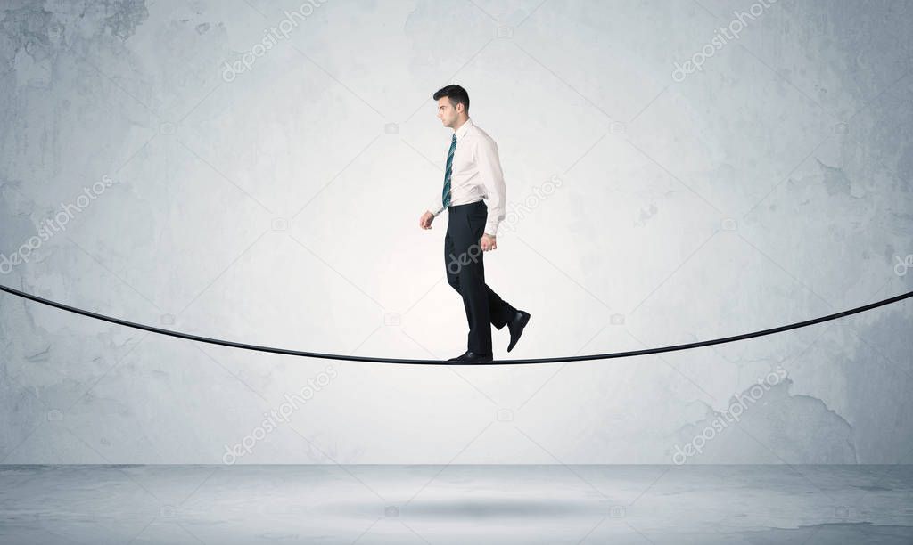 Sales guy balancing on tight rope