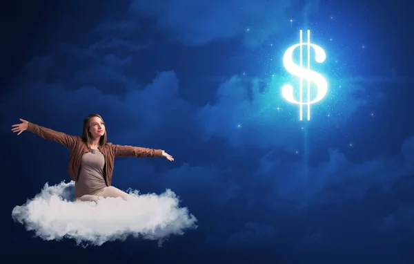 Woman sitting on cloud with cash sign — Stock Photo, Image