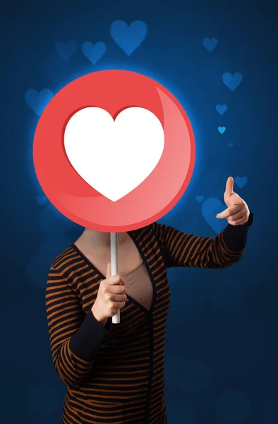 Woman holding heart sign — Stock Photo, Image