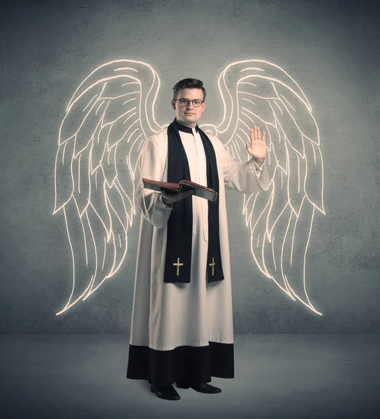 Young priest in giving his blessing — Stock Photo, Image