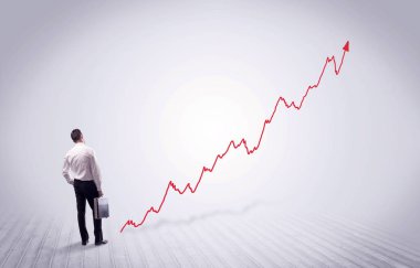 Kırmızı grafik ok ile ayakta işadamı