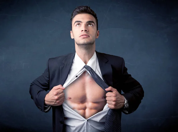 Businessman tearing off shirt and showing mucular body — Stock Photo, Image