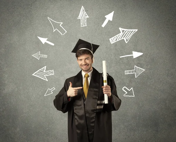 Jeune étudiant diplômé avec des flèches dessinées à la main — Photo