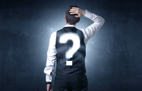 Man standing with question mark on his back — Stock Photo, Image